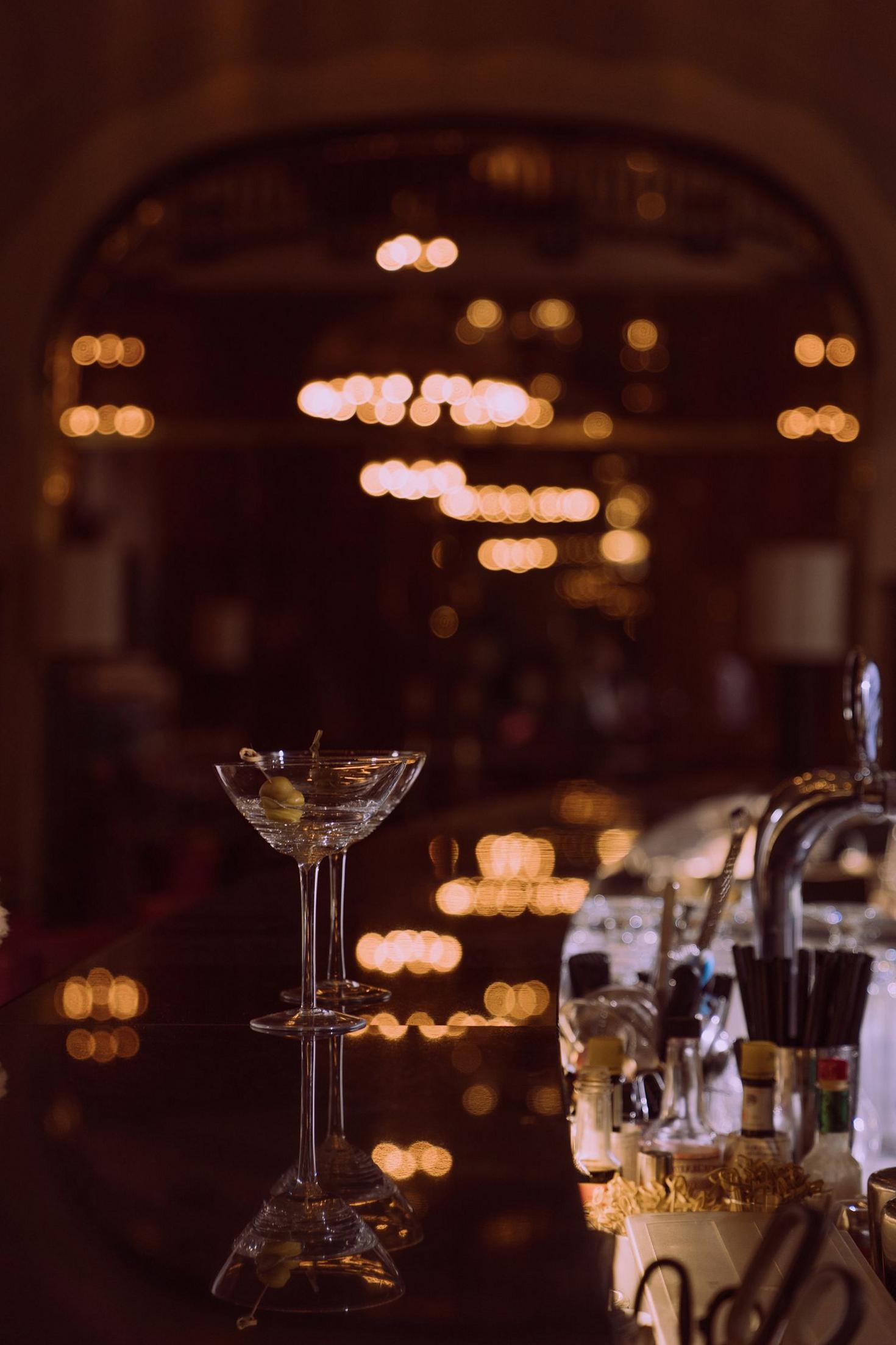 Cocktail glasses on a bar